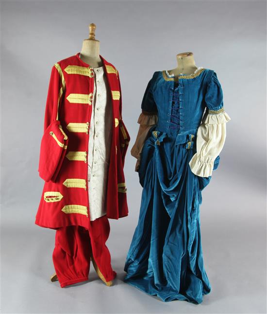 Lucia Di Lammermoor: A rail with a turquoise velvet and gold braided dress, a red and gold braided jacket, a petrol